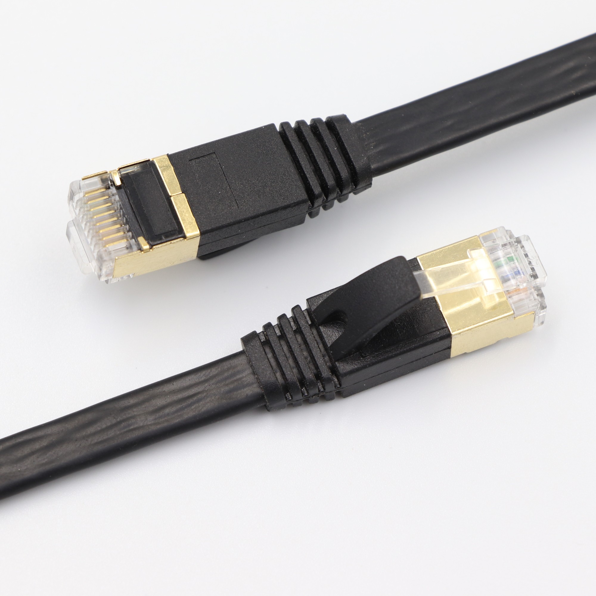 Cat7 Shielded Flat Ethernet Cable - 10Gbps 600MHz S/FTP Ultra-Slim Network Cord with Customizable Molds, Colors, and Lengths Image 3 Ultra-Slim Profile of Cat7 Shielded Flat Ethernet Cable for Under-Carpet Use