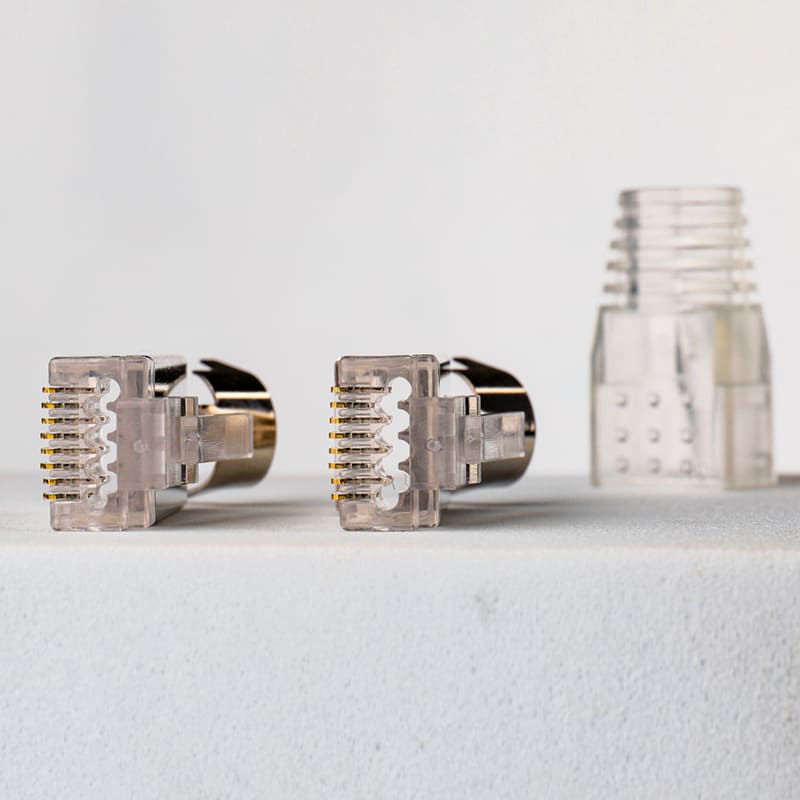 Cat7 Shielded Pass-Through RJ45 Connector - Two-Piece 8P8C STP Modular Plug with Load Bar and Premium Gold-Plated Copper Shell Image 2 Gold-Plated Copper Shielding Shell for Ultimate EMI Protection on Cat7 8P8C Plug